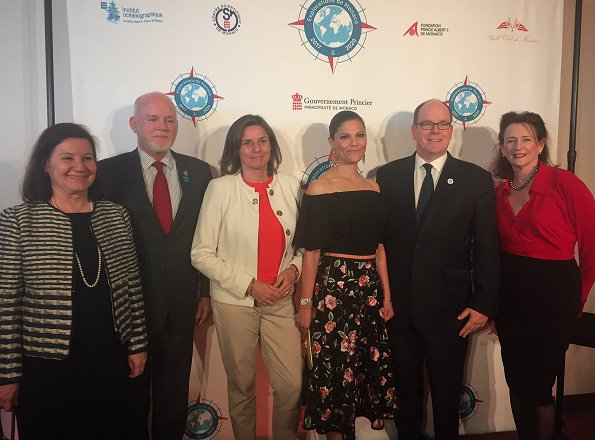 Crown Princess Victoria and Prince Albert of Monaco attended the "Ocean Conference. Princess Victoria wore  floral printed skirt. carried Anya Hindmarch Gold Metallic Clutch