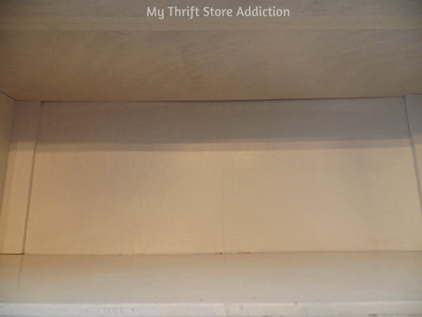 How to Transform Shelves with Thrift Store Paper mythriftstoreaddiction.blogspot.com China cabinet makeover using thrift store draw liners and mod podge.