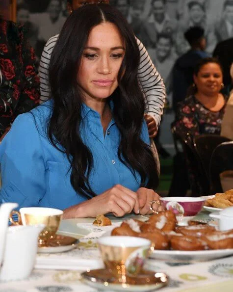 Meghan Markle wore Veronica Beard Sky Blue Cara dress. Duchess is in the same dress she wore on tour in Tonga