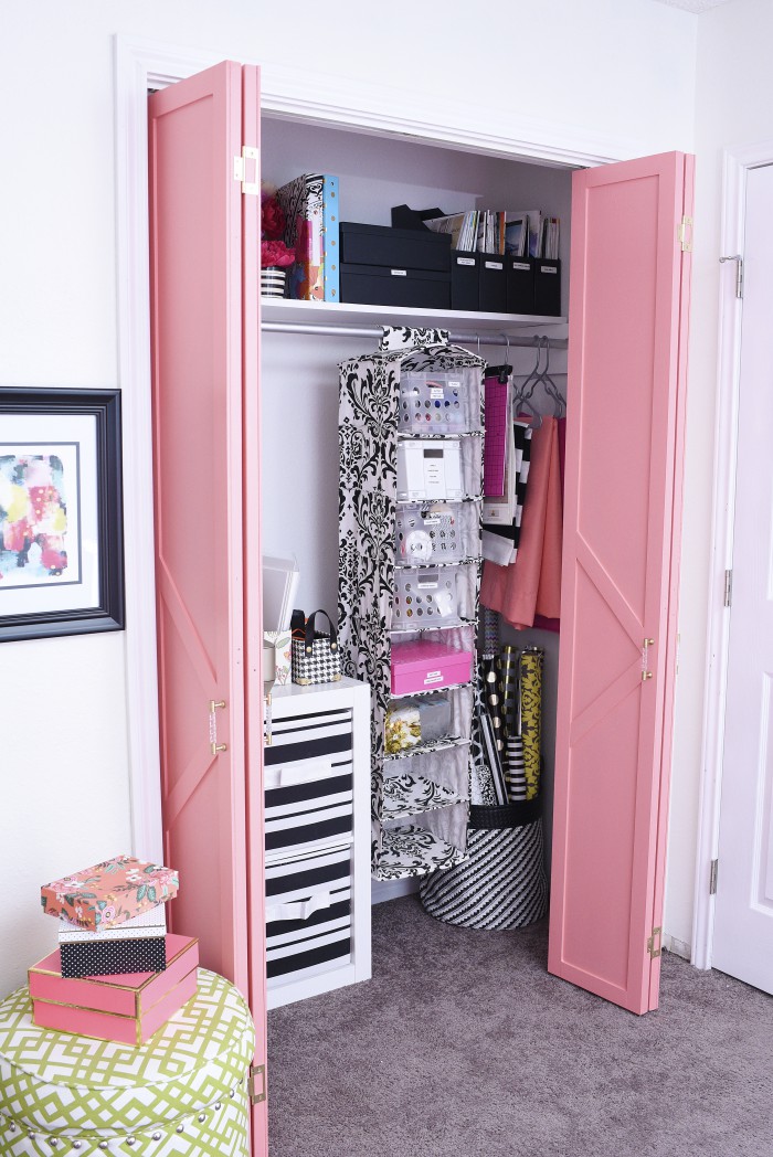 This DIY bifold closet door makeover looks like a million bucks but cost under $50. The paint used in the tutorial is Sherwin-Williams Dishy Coral in a satin finish. The gold and acrylic pulls really make the doors look high-end.
