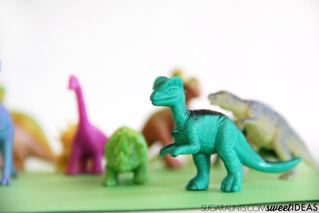 Use plastic dinosaurs in this Goldilocks and the Three DInosaurs jacks game based on Mo Willems childrens book.