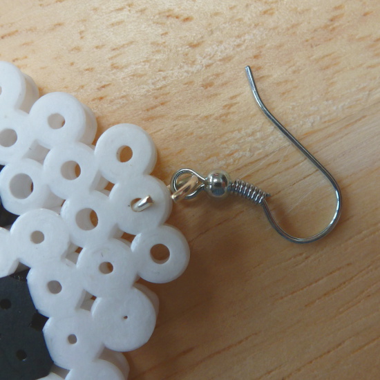 Earring hook inserting into a completed Perler bead motif
