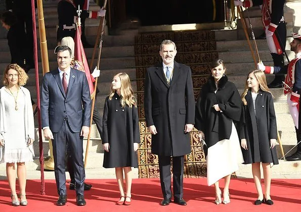 Queen Letizia, Princess Leonor and Infanta Sofía attended the Solemn opening of the Spanish Parliament. Carolina Herrera cape and dress