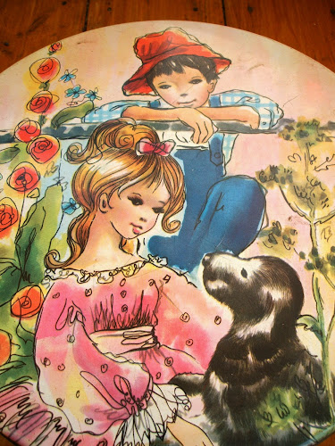 vintage gingham design kitsch enamel biscuit tin with girl, boy and dog