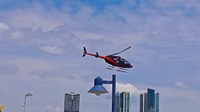 Helicopter above street lamp