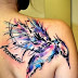 ABSTRACT HUMMING BIRD TATTOO