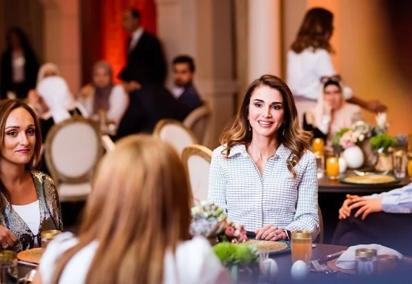 Queen Rania of Jordan held an Iftar banquet for Jordanian youth at Basman Palace wore asymmetric belted shirt dress, she carried Louis Vuitton bag