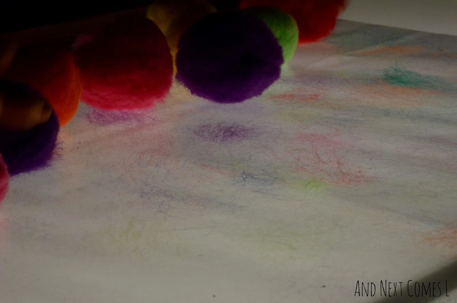Sticky pom pom art on the light table from And Next Comes L