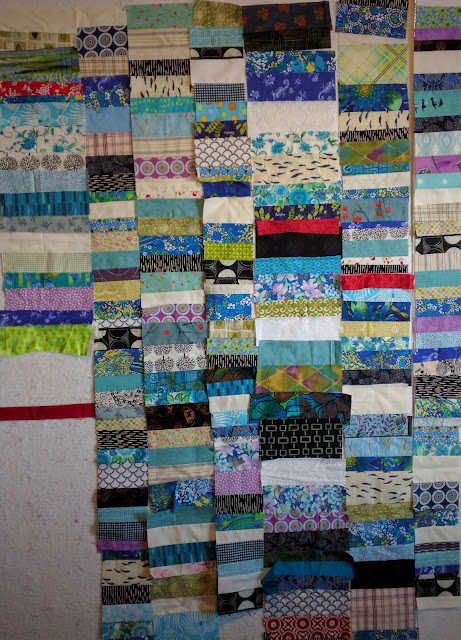 Designing a Chinese Coin quilt with vintage household materials