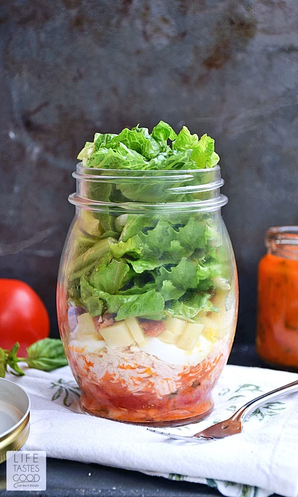 Cobb Salad in a Jar | by Life Tastes Good is a convenient way to take a fresh meal with you anywhere you go! Work, school, picnics, road trips, you name it! This salad likes to travel! Just add a fork <smile>. It's also the perfect make-ahead meal to have on hand for those busy days when you are just too tired to cook.