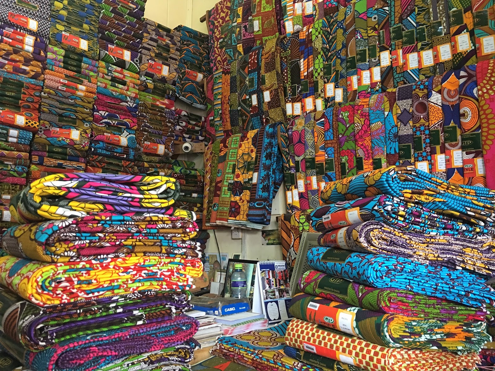 Quilts and Boxes Buying African fabrics at Makola Market in Accra