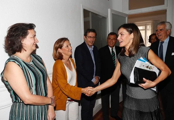 Queen Letizia wore Hugo Boss Franca Stretch Cotton Dress, Steve Madden suede pumps and she carried Carolina Herrera clutch bag