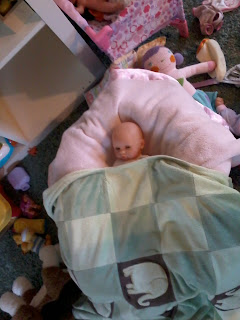 Baby doll under blanket