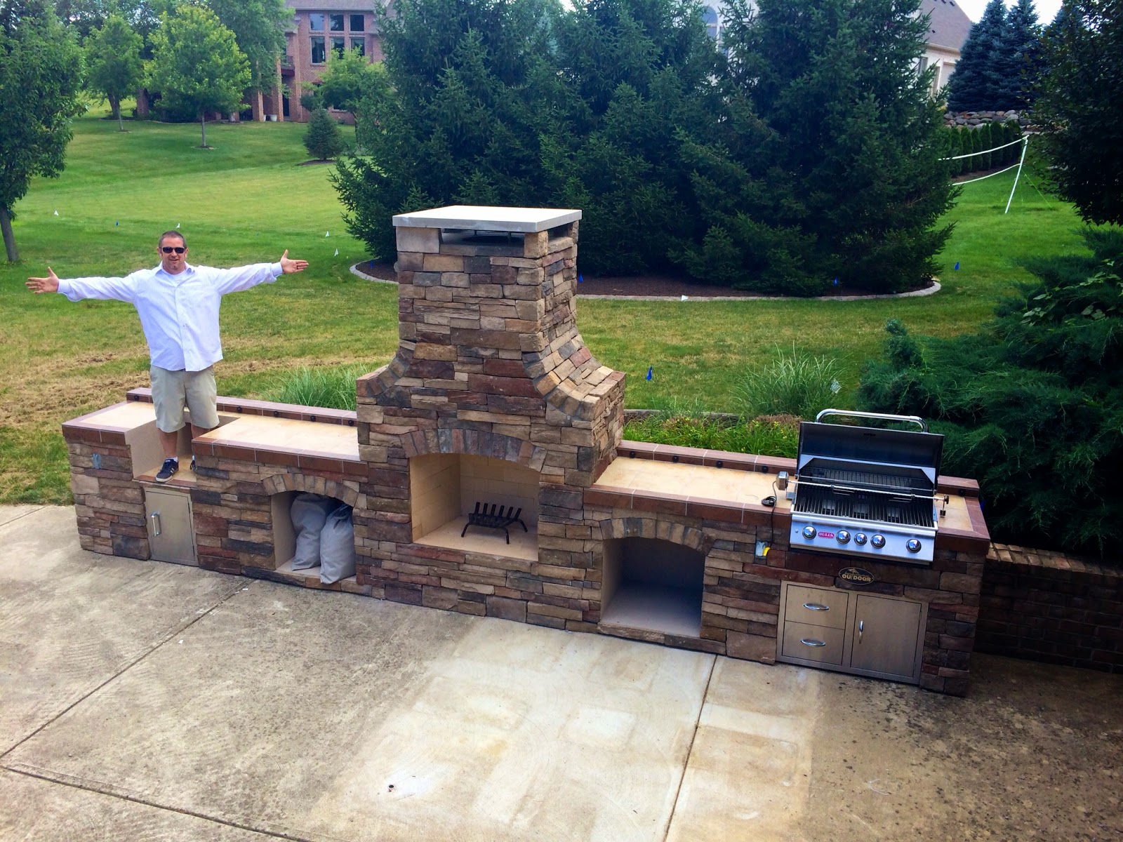 Outdoor Living Outdoor Fireplace, Smoker, and Bull Angus Outdoor Grill