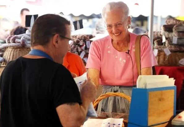 Danish Queen Margrethe visited an open-air market which is in the square outside Cahors cathedral