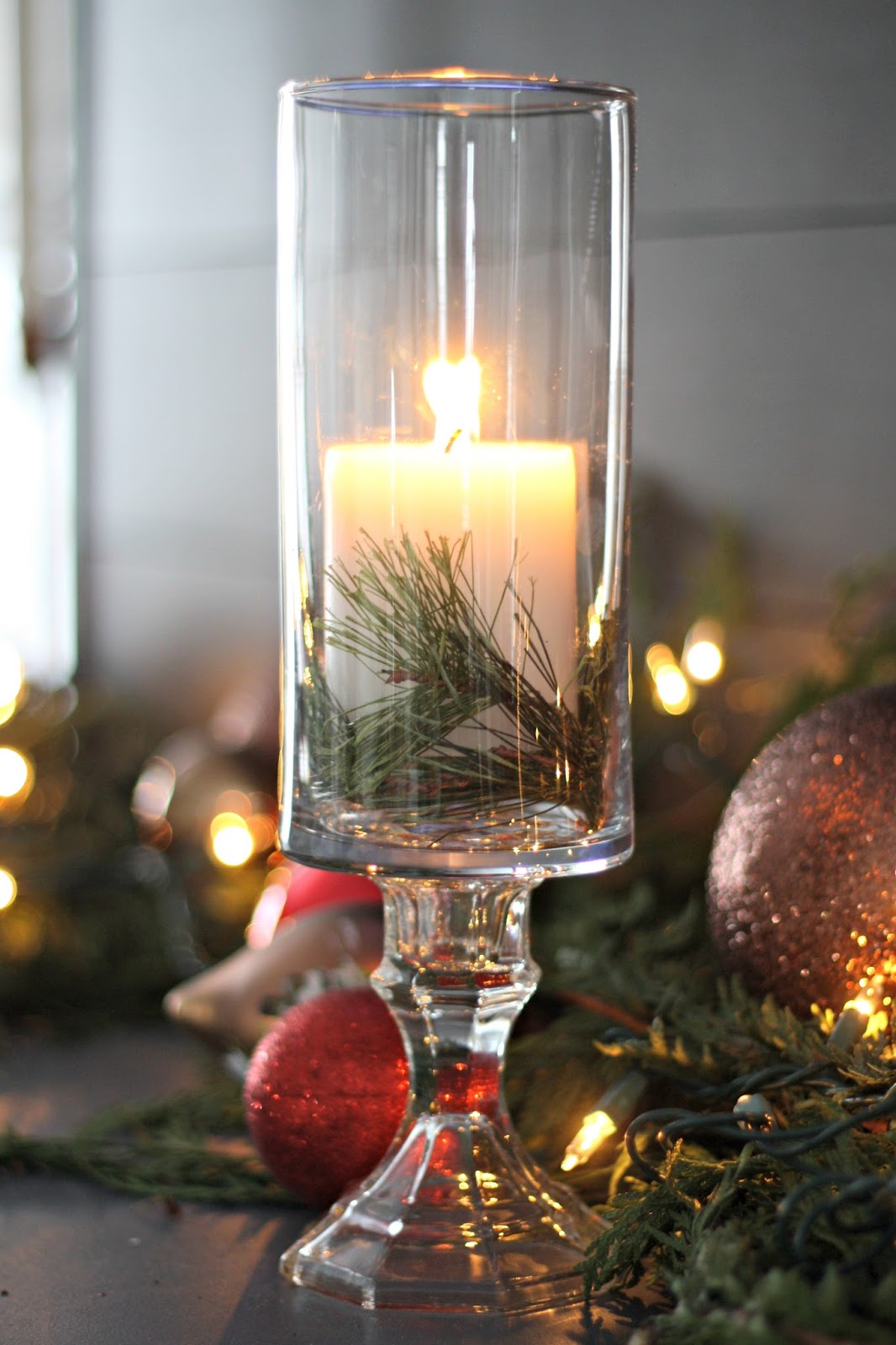 DIY dollar store pedestal candle with greenery