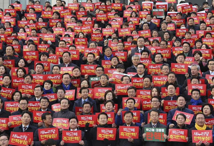 South Korean lawmakers demanding the impeachment of Park Geun-hye in December 2016