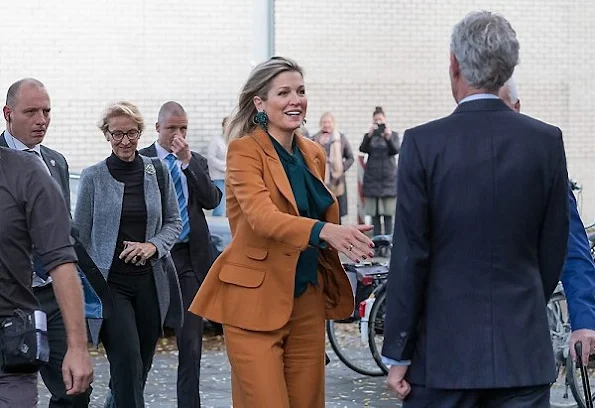 Queen Maxima wore Claes Iversen Pan-Suit from the AW2015 the collection and Gucci Silk Shirt Blouse, Natan Earrings