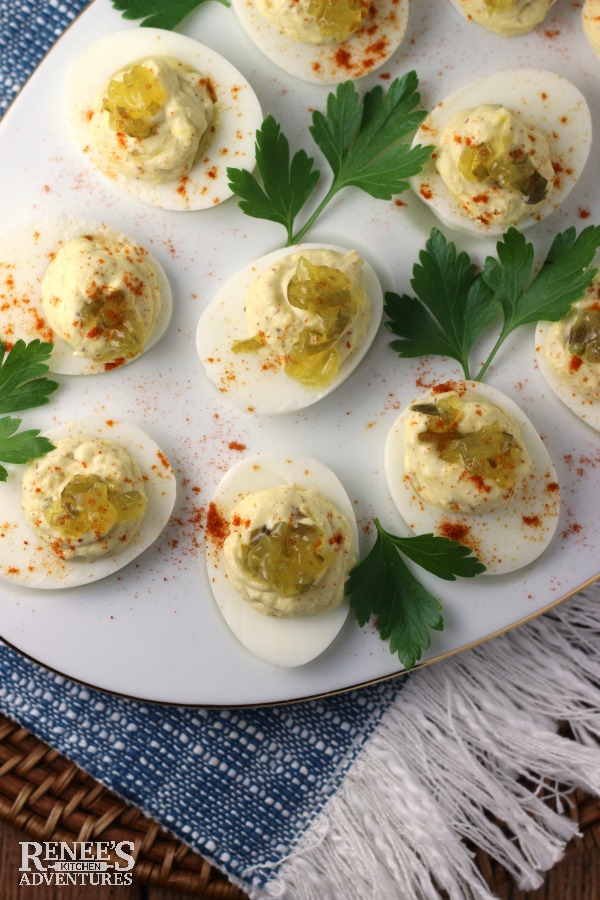 Sweet Relish Deviled Eggs by Renee's Kitchen Adventures overhead view on white platter with parsley garnish