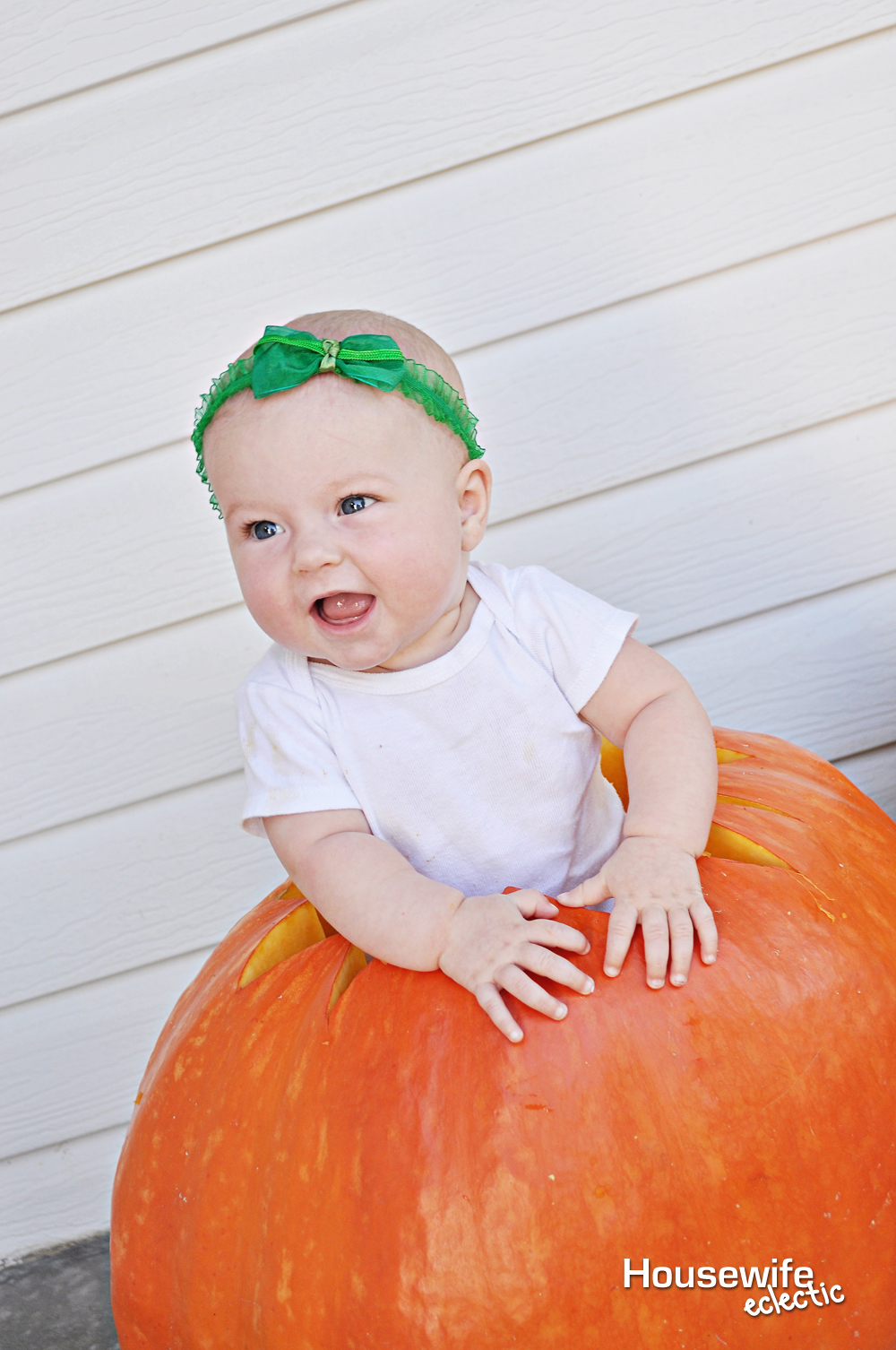 baby in a pumpkin photo to remember babys first halloween