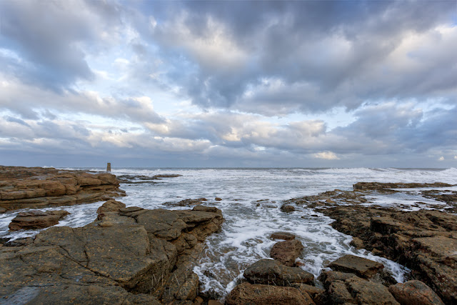 Rocky coast and stormy clouds at Whitley Bay