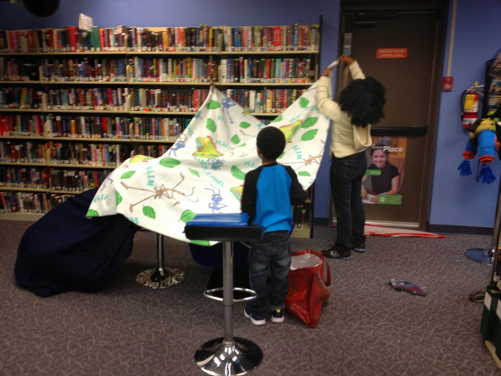 kids building a fort in a library