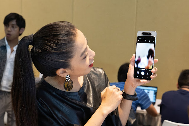 Chrystina Ng, Host of E! News, checking out rotating camera setup of the new Galaxy A80 The Latest A Series - Samsung Galaxy A80