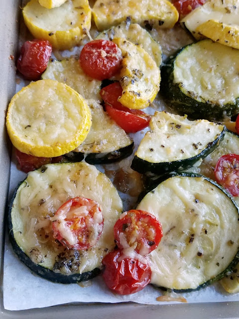 Turn those fresh summer vegetables into a delicious side dish the whole family with love. Parmesan roasted zucchini and tomatoes is simple and delicious! parmesan roasted zucchini and cherry tomatoes on a sheet pan