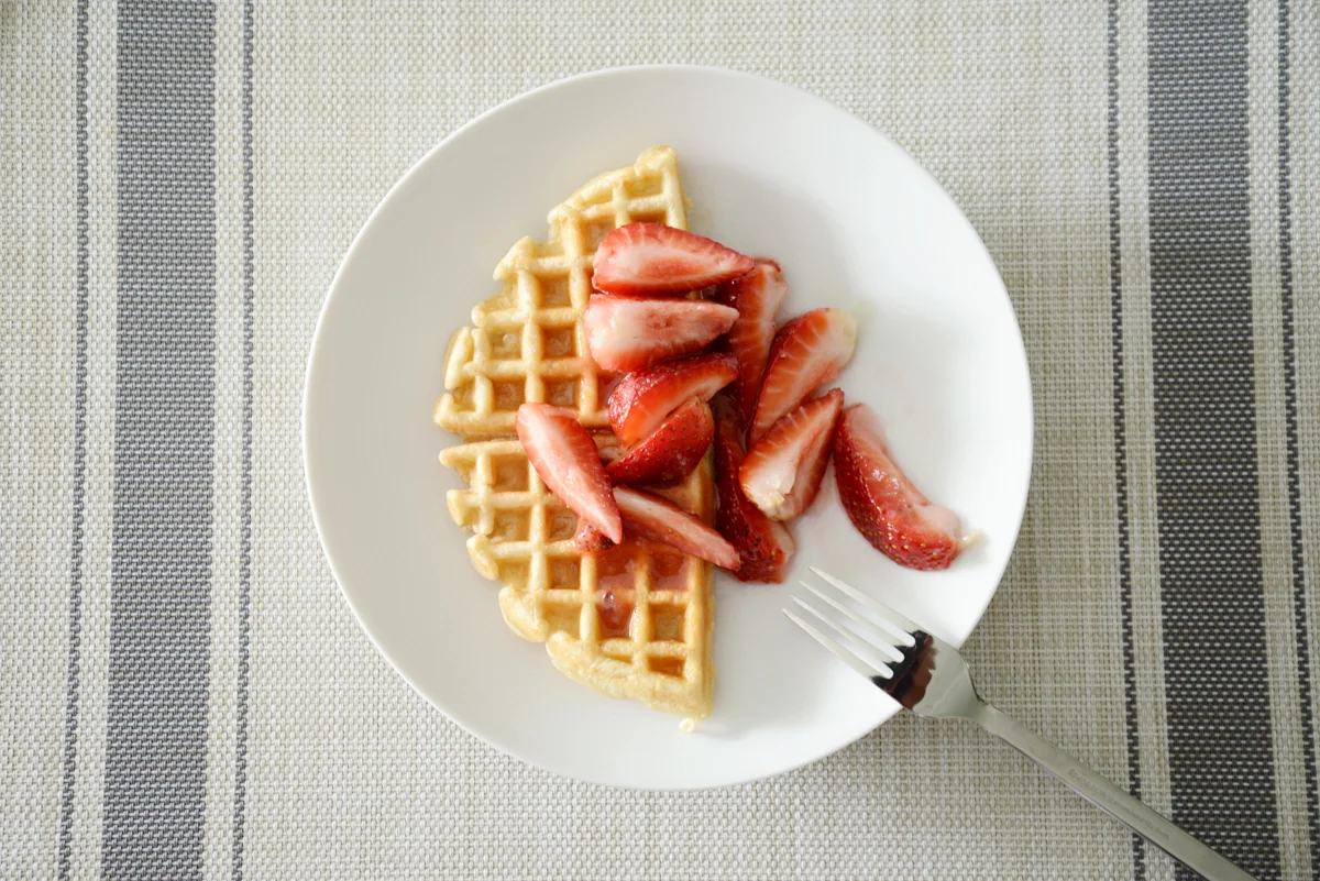 macerated strawberries and waffles