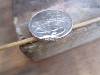 Coin after use as "gear holder" Yamaha 2 stroke