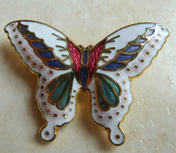 http://www.kcavintagegems.uk/vintage-enamel-white-butterfly-brooch-133-p.asp