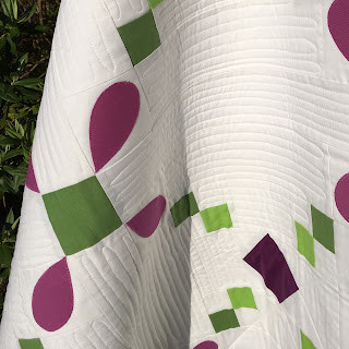 quick step quilt with free motion quilting design