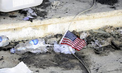 A US flag lies amid the rubble at the US consulate in Benghazi, Libya, where diplomat Chris Stevens and three others were killed on 11 September. Photograph: Stringer/EPA