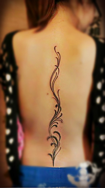 totem flower tattoo on the back