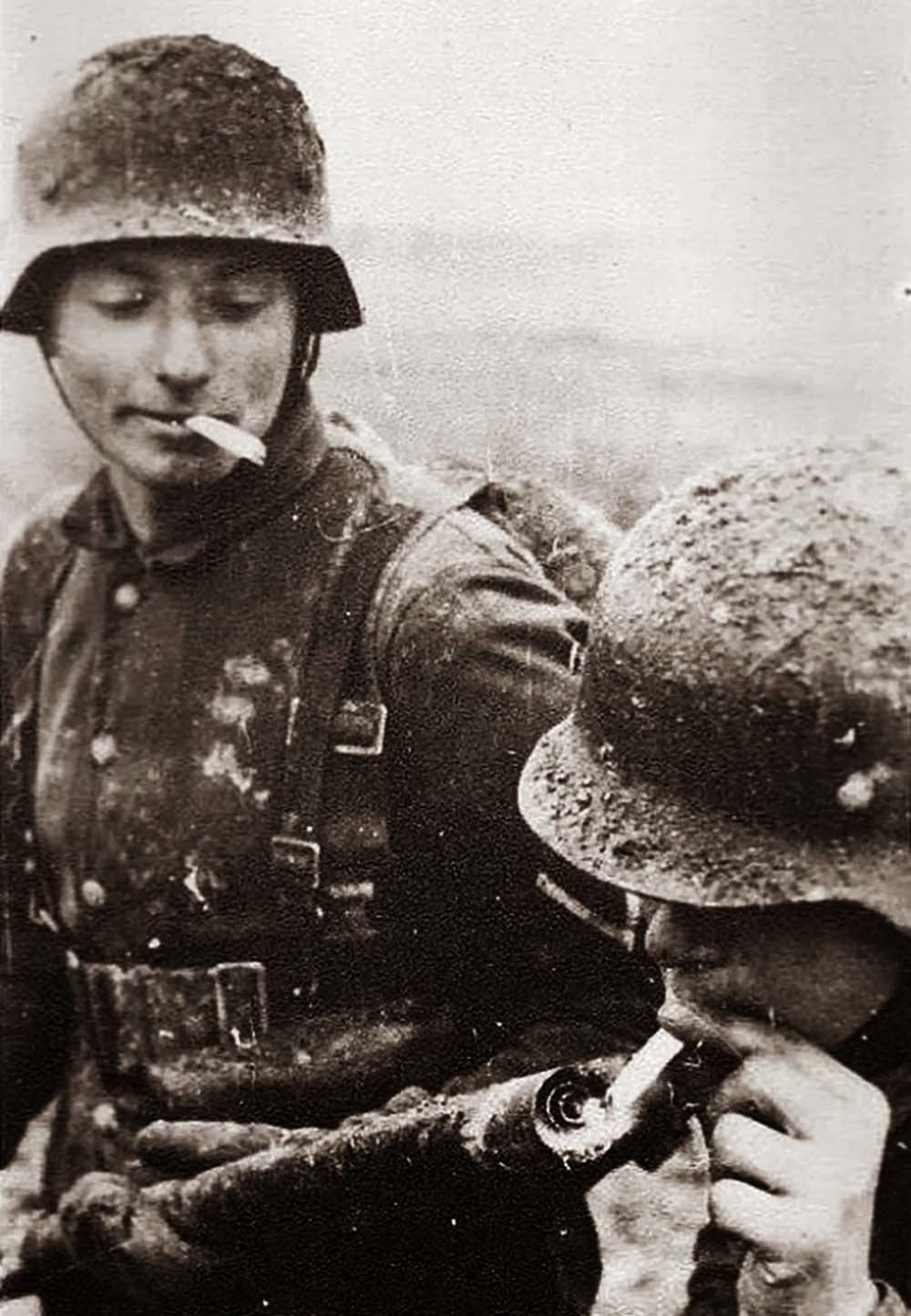 German soldier lighting his cigarette with a flamethrower, 1917.