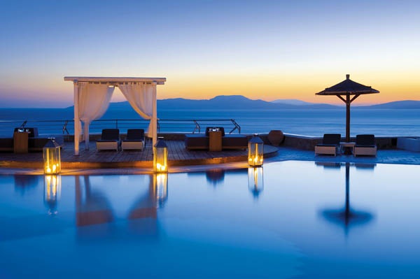 Mykonos Grand Hotel is a luxury beach resort displaying a harmonious architecture