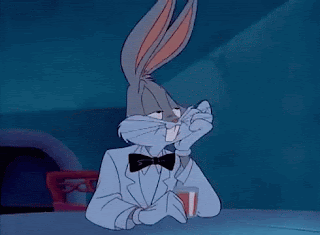 Animated gif Bugs Bunny's head turning into a lolly that reads `Sucker!`.