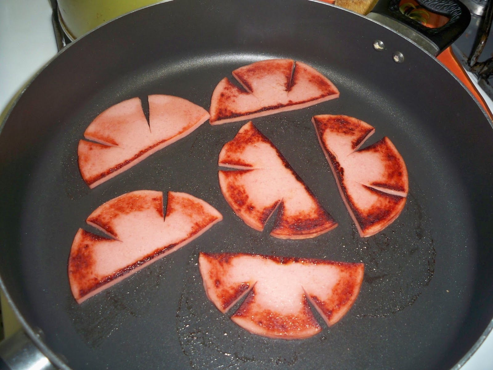 Gramma's in the kitchen Fried Bologna Sandwiches.that's good eaten'!