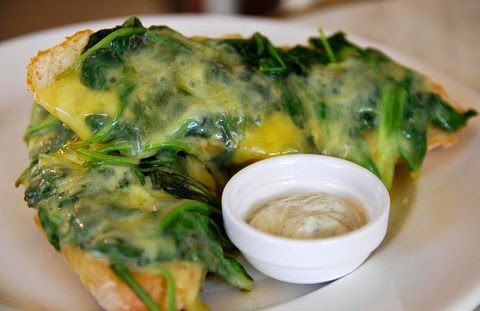 Garlicky toasted baguettes with spinach