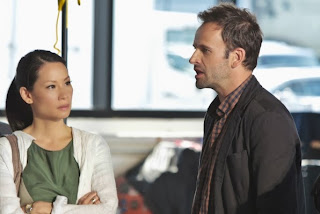 Jonny Lee Miller and Lucy Liu as Sherlock Holmes and Joan Watson in CBS Elementary