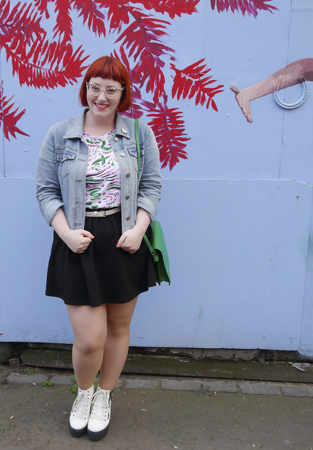 Edinburgh Street Style from Wardrobe Conversations Wardrobe Conversations, styled by, Scottish Blogger, Edinburgh blogger, red hair, ginger bob, girl with glasses, Spex pistol glasses, Monki patterened tshirt, bright patterened tshirt, bright green handbag, black skater skirt, white lace up boots, Edinburgh street style, Jewellery club, cactus jewellery, cacti jewellery, plant jewellery, subscription box, jewellery subscription box, illustrated jewellery, denim jacket, Kirsty Whiten, Kirsty Whiten Street art, street art Edinburgh, House of Wonderland, #monkistyle