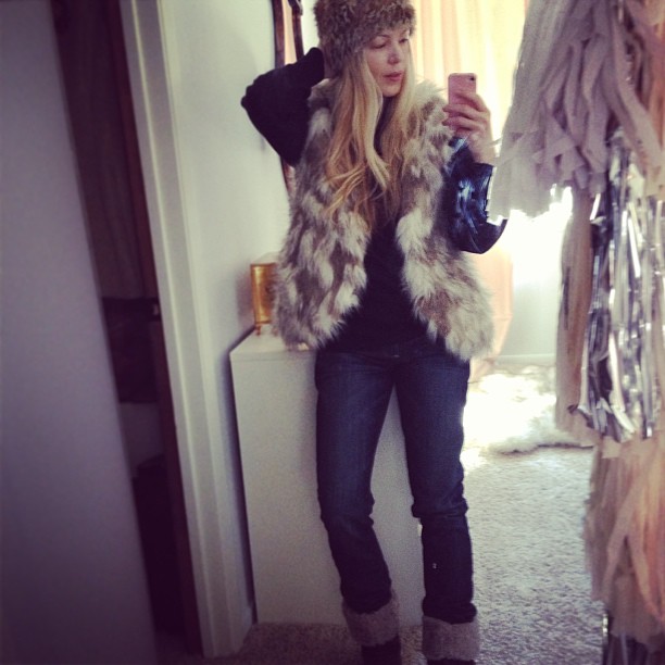 faux fur vest and jeans