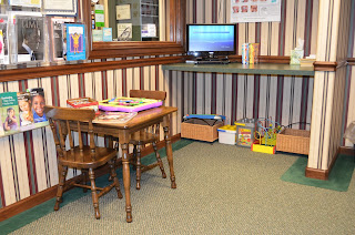 Dr. Poz Waiting room, features children's space with toys and games.