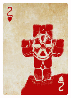 The Deck of Loss shows a mile marker with monks on a wheel mounted on a stone cross.  This is for the cards of loss and regret.