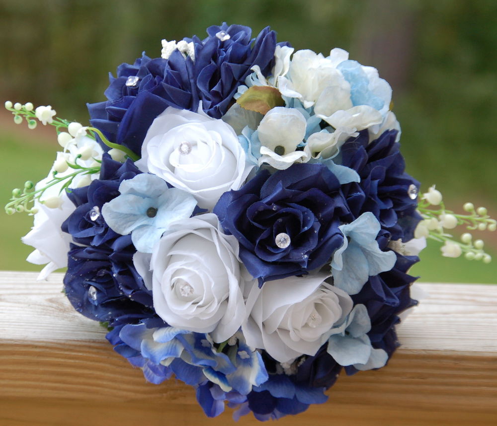 Faux wedding bouquets in navy blue flowers and eucalyptus greenery. 