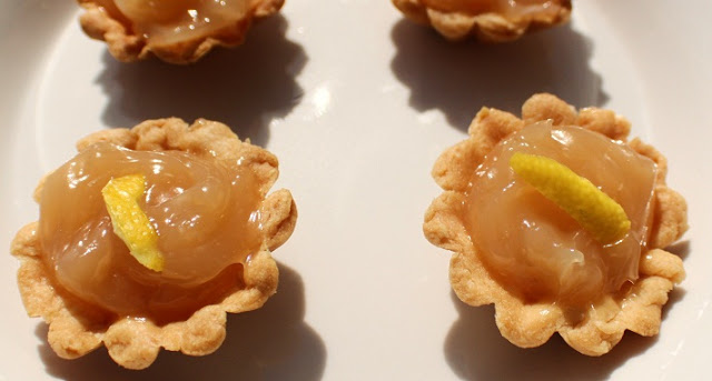this is how to make homemade lemon curd in little pie shells tarts