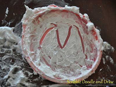build pre-printing skills by drawing letters in shaving cream