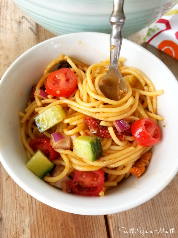 Spaghetti Salad! A unique, delicious overnight pasta salad recipe made with spaghetti noodles, bottled AND dry mix Italian dressing, sundried tomatoes and tons of veggies!