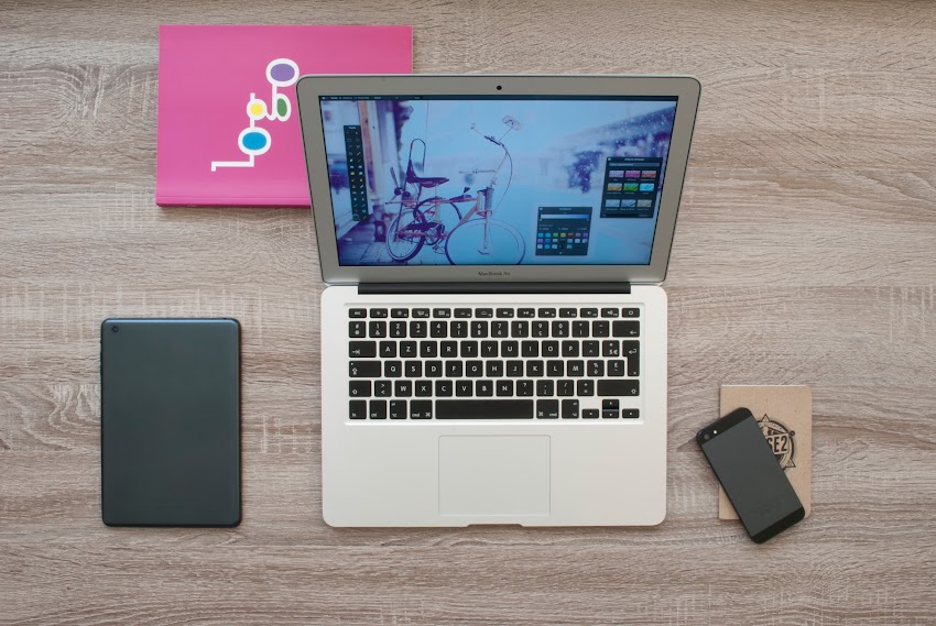 Tab Laptop Phone And Book On Table Tab Laptop Phone And Book On Table