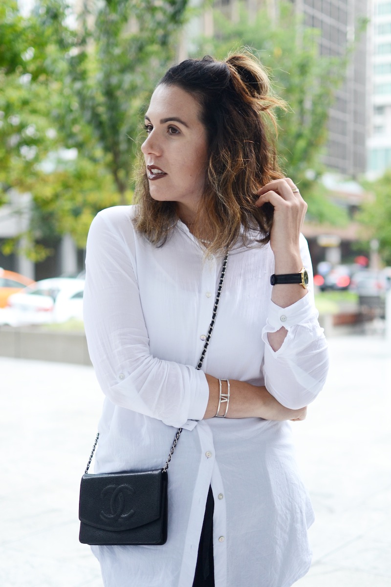 Vancouver fashion blogger Aleesha Harris styles the Wilfred Allant pant from Aritzia with a CHANEL wallet on a chain and Alexander Wang Kori boots.